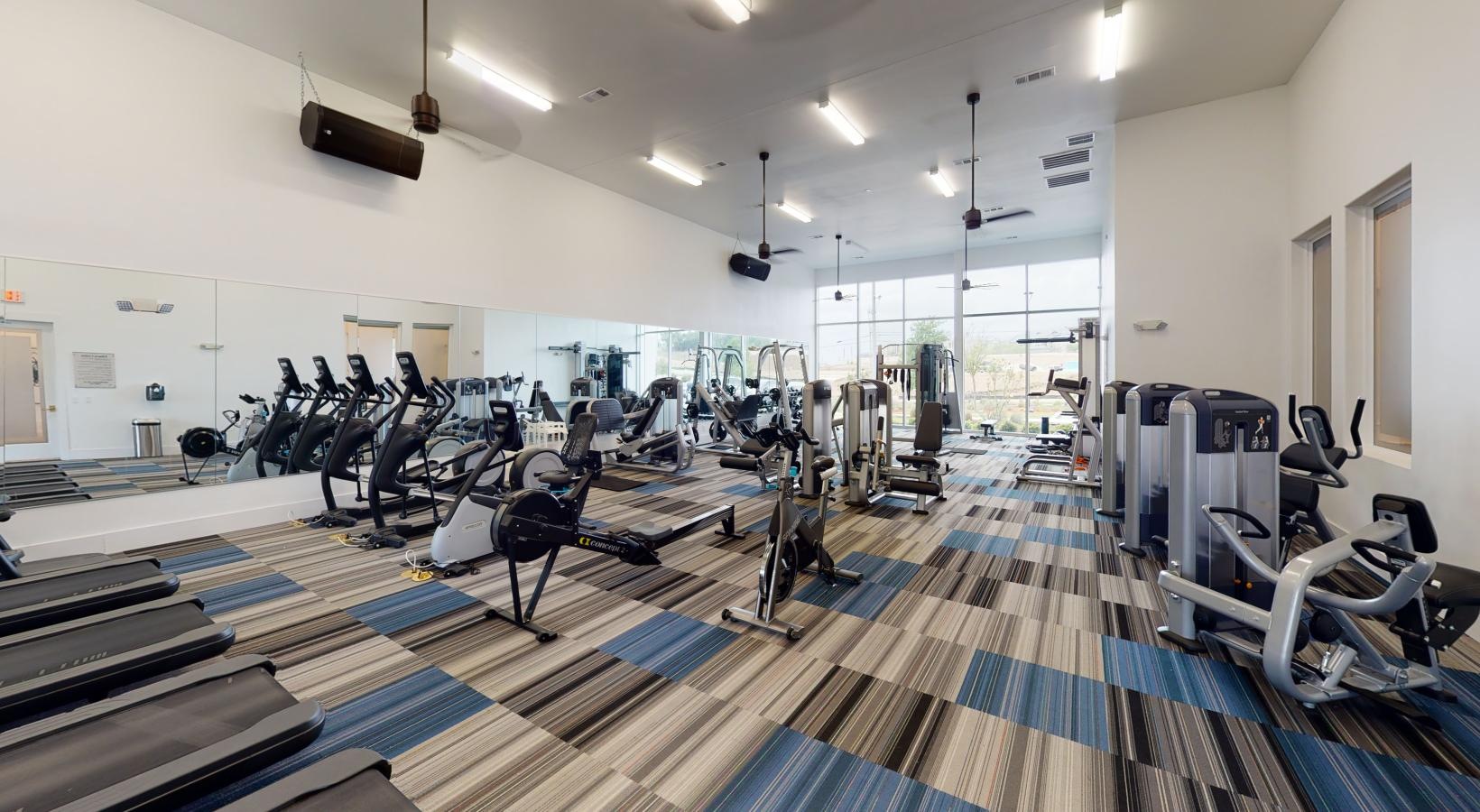 Cutting-edge amenities at your fingertips a gym with exercise equipment