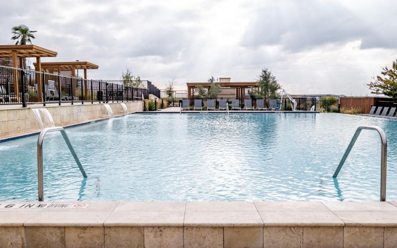 a pool with a building in the background