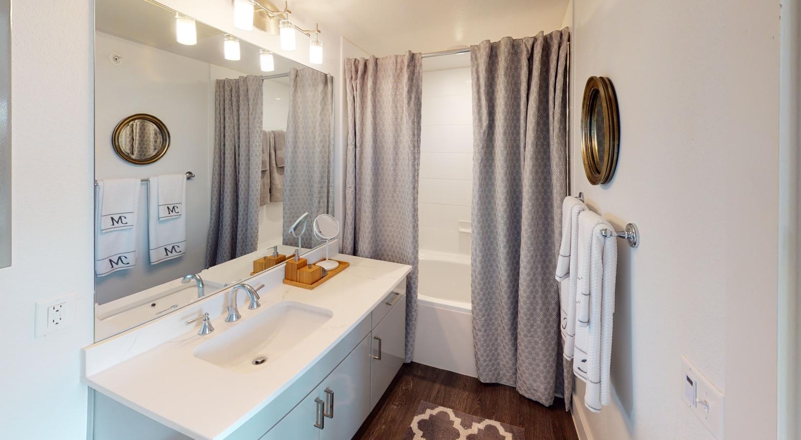 Bathroom options with thoughtful details a bathroom with a sink and a mirror