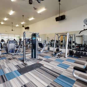 State-of-the-art amenities a gym with exercise equipment
