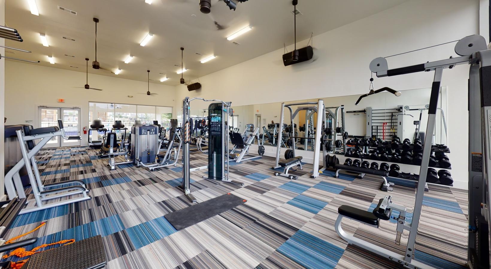 State-of-the-art amenities a gym with exercise equipment