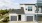a white house with garages