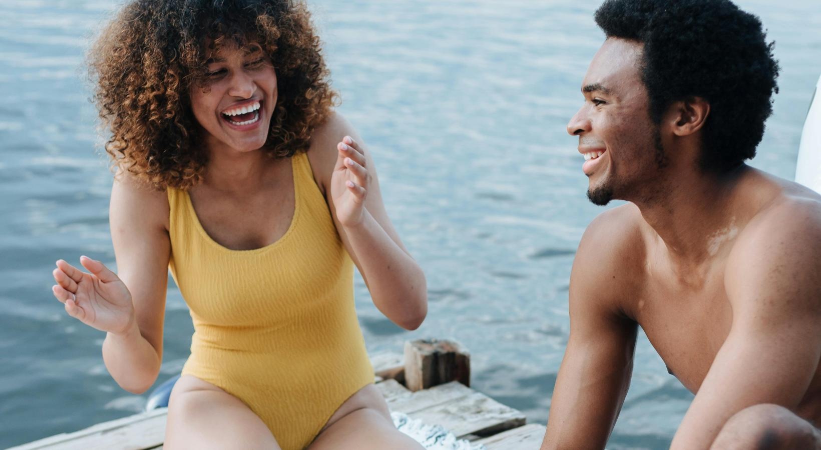 The essence of exceptional living a man and woman sitting on a beach