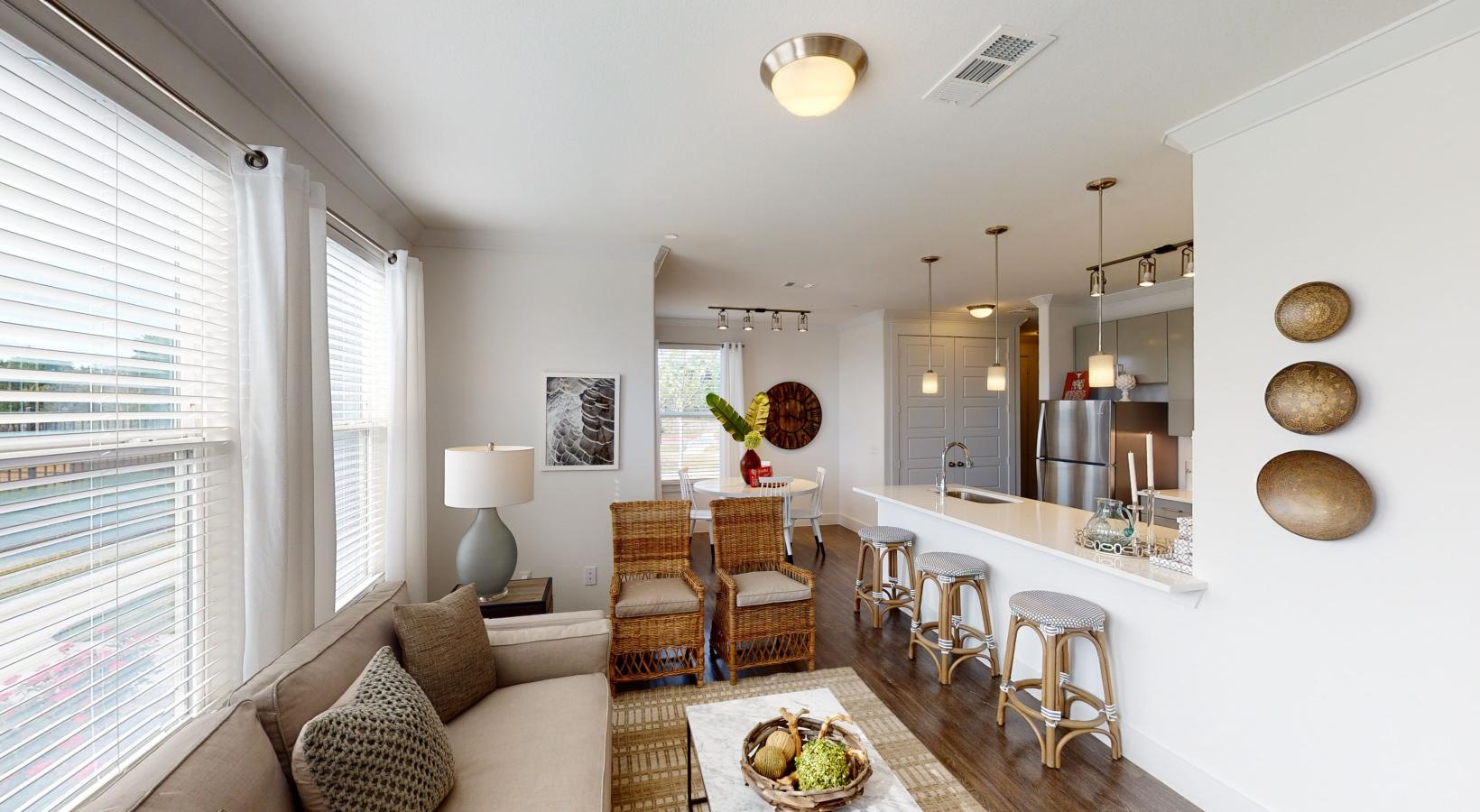 Spacious living areas to recline and recharge a living room with a large mirror