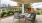 a patio with chairs and a table