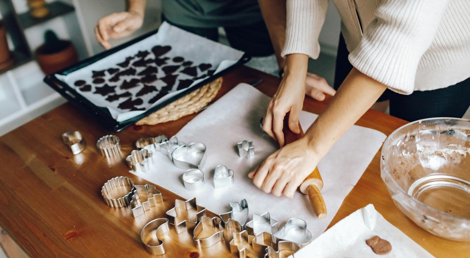 Settle into comfort at Reveal 54 a person baking cookies