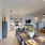 a large kitchen with a dining table