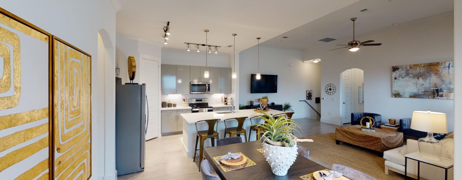 a large kitchen with a dining table
