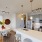 a kitchen with a dining table and chairs